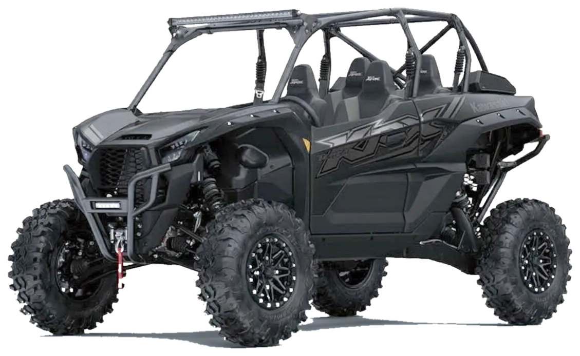Black Kawasaki KRX four-seat side-by-side with roll cage, light bar and knobby off-road tyres, shown from the front three-quarter angle